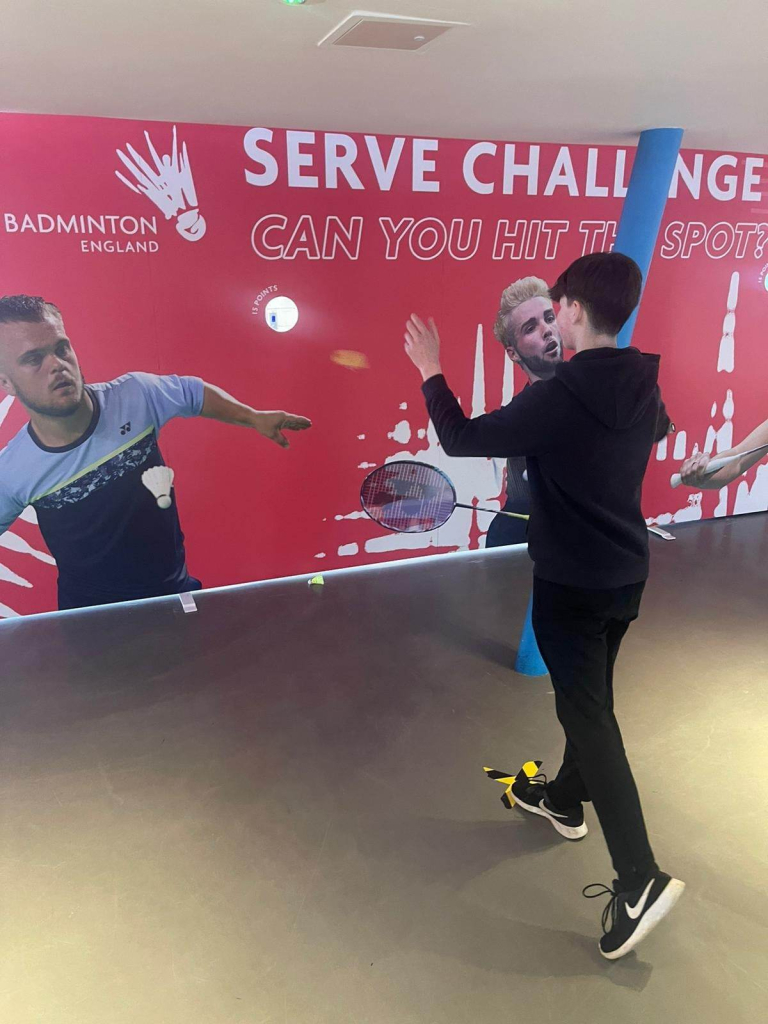 student playing badminton game