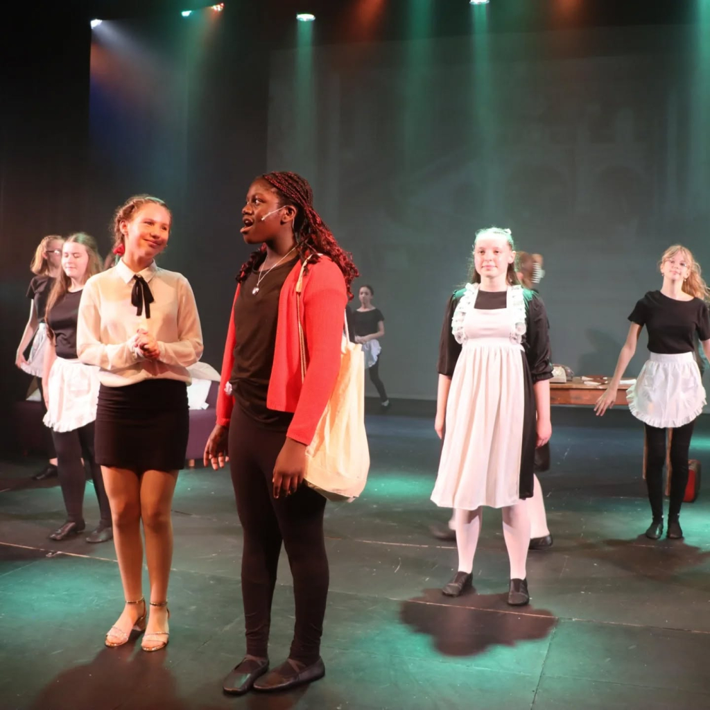 Students performing in annie production