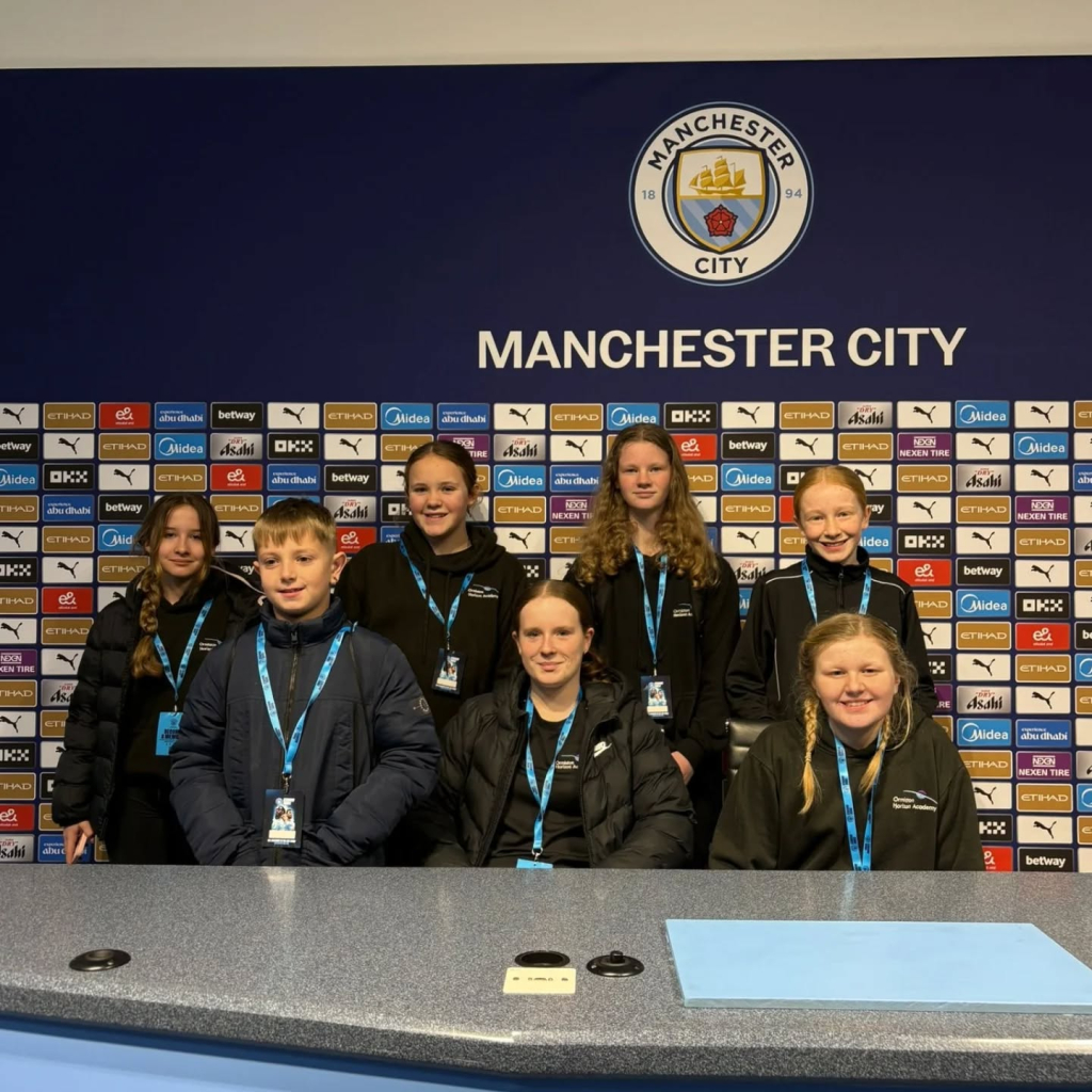 students at etihad stadium